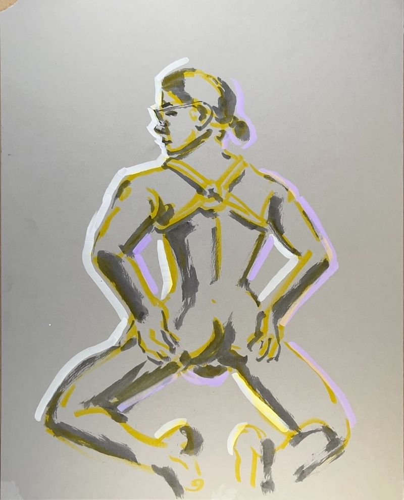 Bruiser wearing a harness from the back