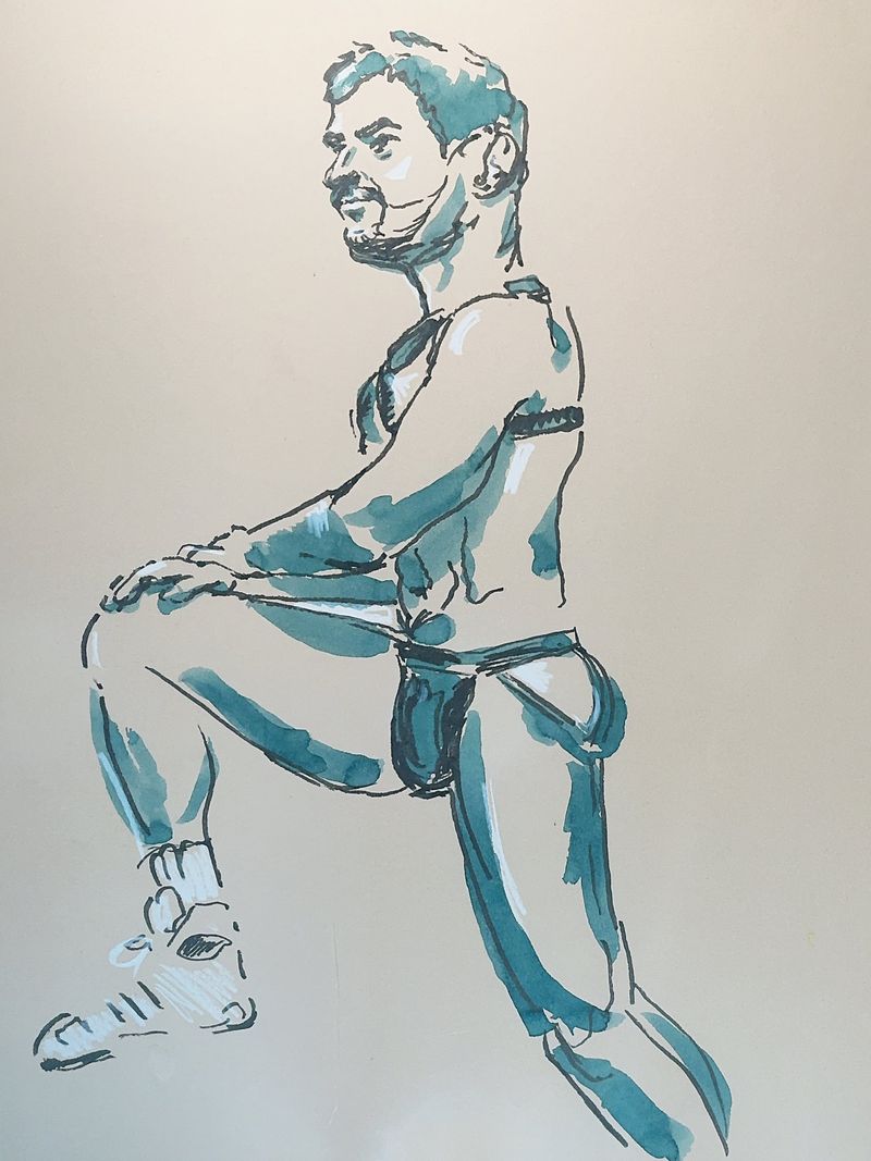 Nicholas in knee-up pose with watercolor marker.