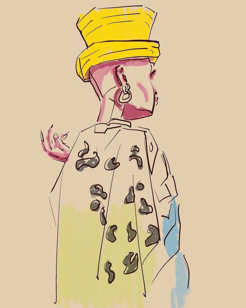 Shaquita in a leopard print cape