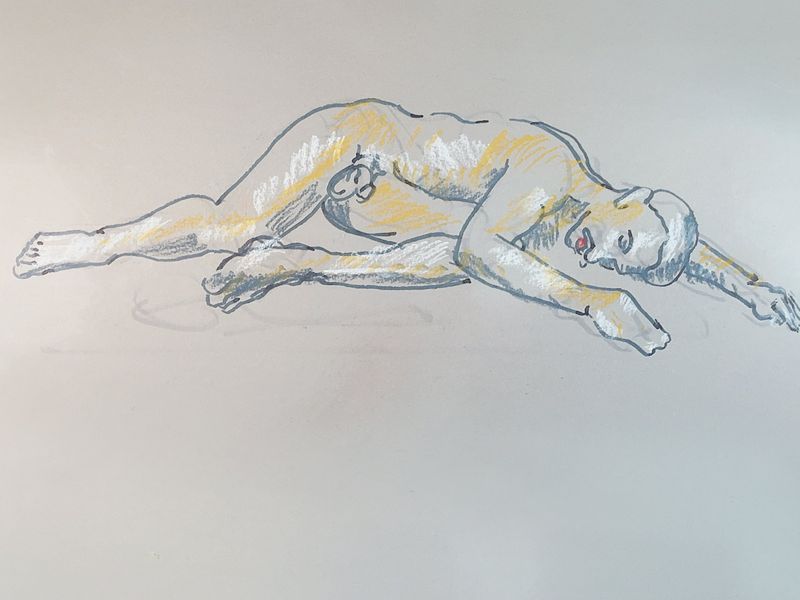 A reclining male figure with one bent leg is drawn in pastel pencil on toned paper.
