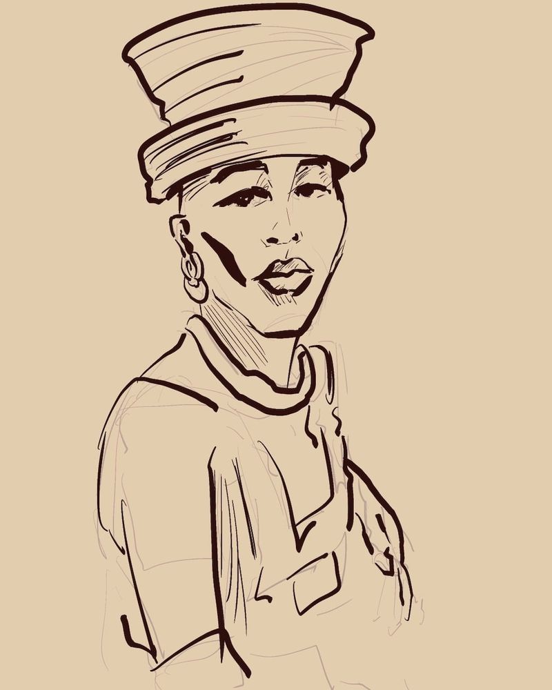 Shaquita in a large hat