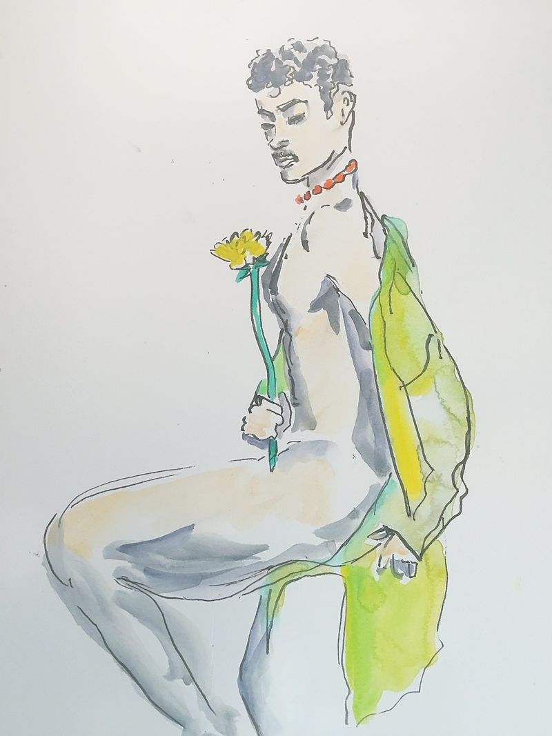Model seated with flower and cape