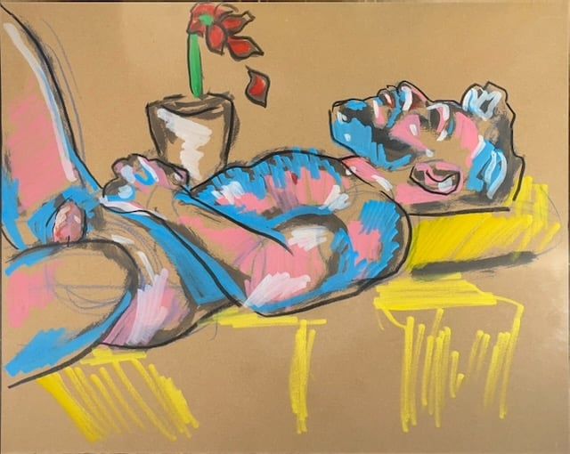 Mr. Teddy Bear Lying on a table with flowers